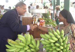 Gov. John deJongh Jr. greets local grower Violet Drew at the rededication of Frederiksted's Ann E. Heyliger Vegetable Market. Gov. John deJongh Jr. greets local grower Violet Drew at the rededication of Frederiksted's Ann E. Heyliger Vegetable Market.